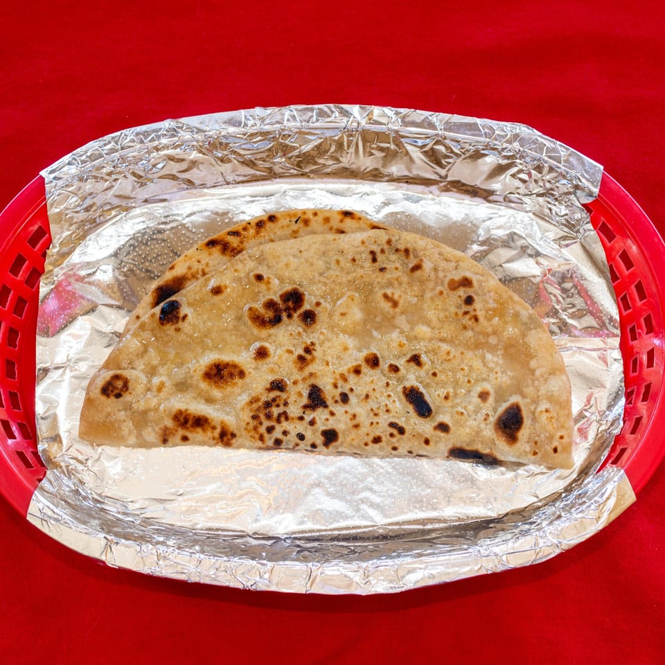 Chapati served in a basket.