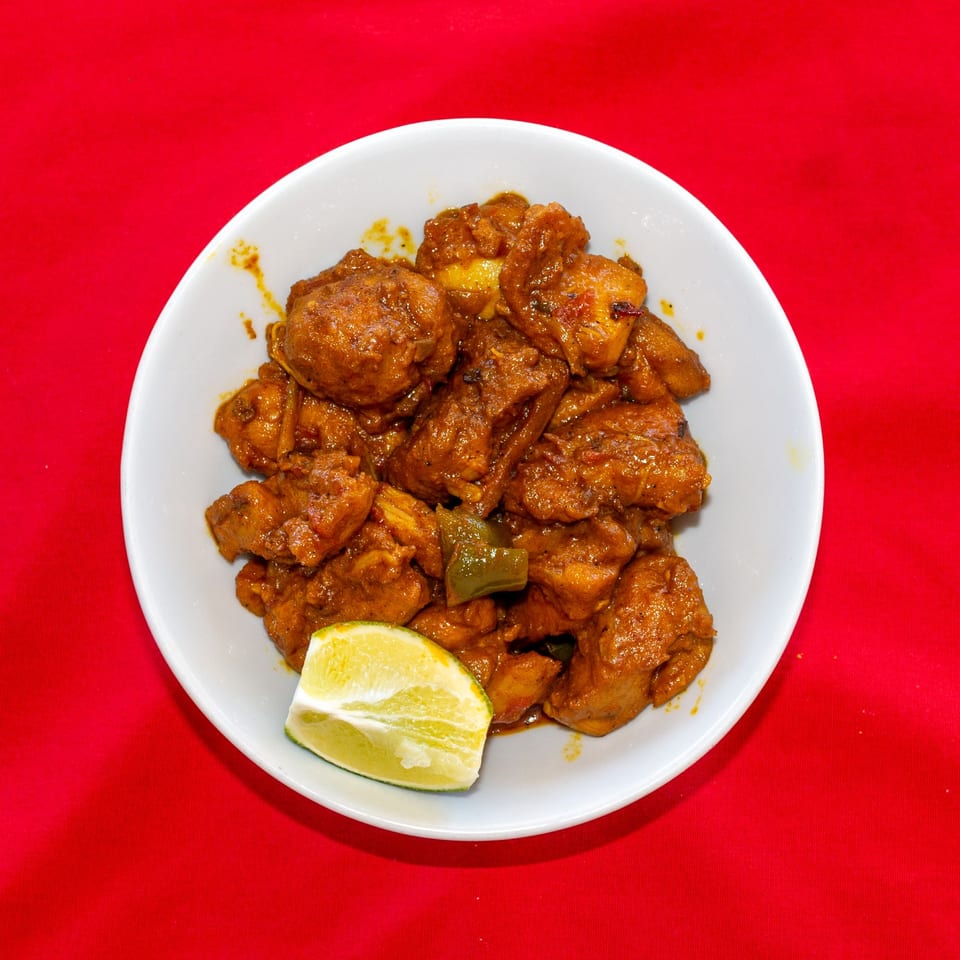 Chicken roast with a lime wedge.
