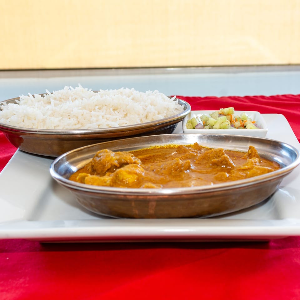 Chicken curry served with rice.